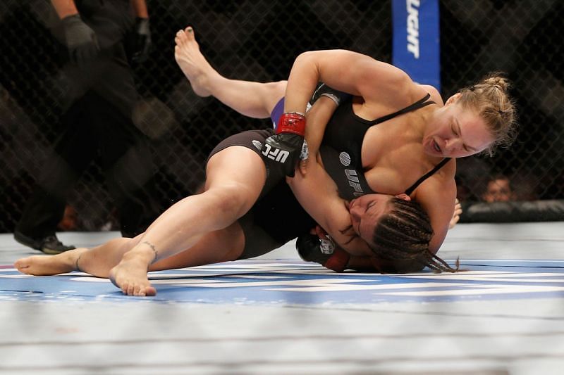 Ronda Rousey takes Alexis Davis down at UFC 175